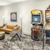 Spacious and well lit game room with arcade games 
